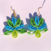 Elevate your style with the Radiant Bloom Earrings. Handcrafted with paper quilling in vibrant blue and green, lightweight and perfect for any occasion.