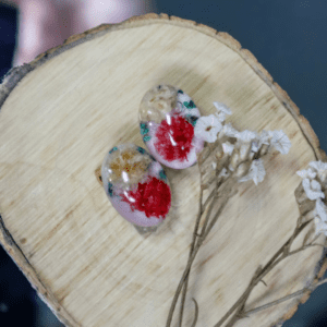 Handcrafted clip-on earrings with real dried flowers preserved in resin, gold-plated stainless steel backs, lightweight and comfortable design