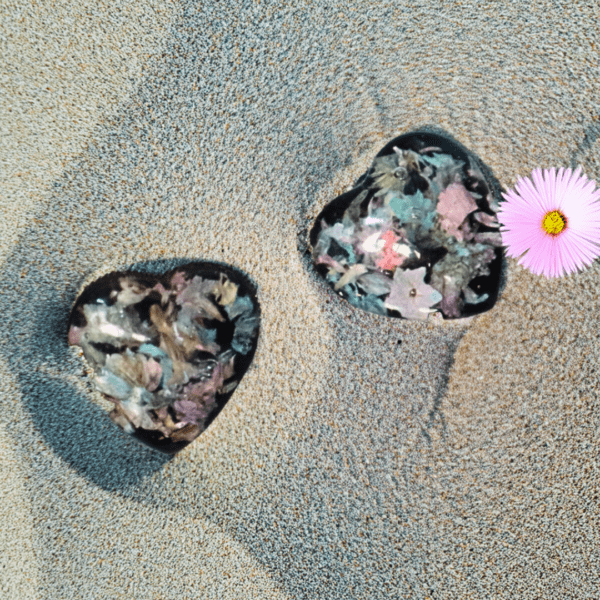 Heart-shaped clip-on earrings with dried flowers encased in resin, lightweight and dainty at 2 cm