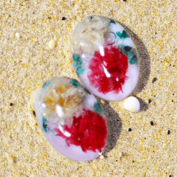 Handcrafted clip-on earrings with real dried flowers preserved in resin, gold-plated stainless steel backs, lightweight and comfortable design