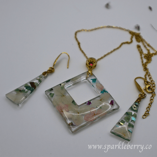 Timeless Blossom Resin Jewelry Set with a square pendant and tapered earrings, featuring pressed flowers encased in premium resin with hypoallergenic hooks.