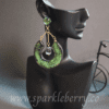 Handcrafted emerald green drop earrings with crescent design, gold-plated chains, lightweight at 9g, and 7 cm long