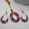 Floral resin jewelry set featuring pressed pink flowers and abalone shells in hypoallergenic earrings and a gold-plated pendant.