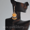 Handcrafted golden resin earrings with genuine Swarovski beads and silver-toned filigree design