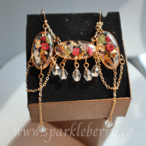 Handcrafted earring and necklace set with dried flowers, gold flakes, crystal beads, and gold-plated stainless steel chain.