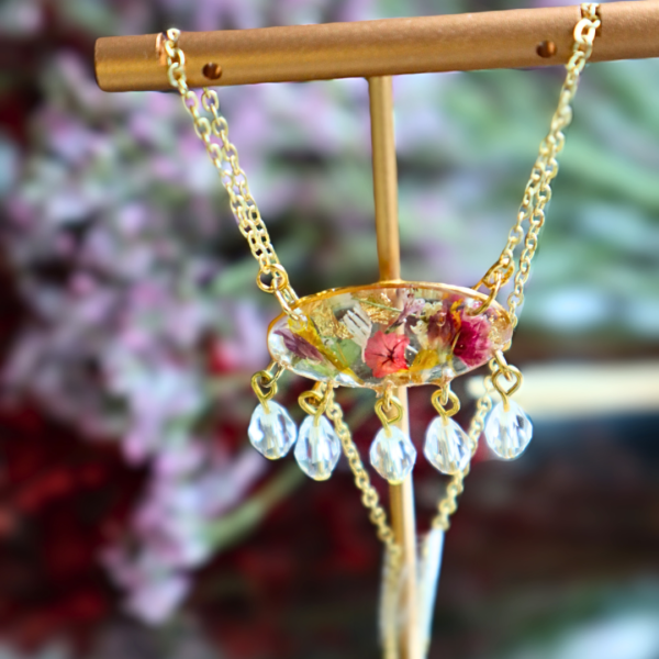 Handcrafted earring and necklace set with dried flowers, gold flakes, crystal beads, and gold-plated stainless steel chain.