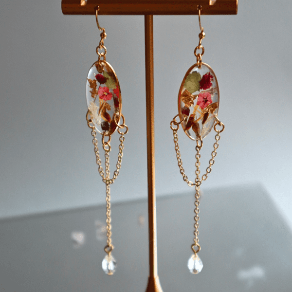 Handcrafted earring and necklace set with dried flowers, gold flakes, crystal beads, and gold-plated stainless steel chain.