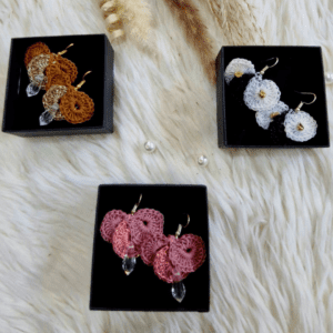 Handcrafted crochet earrings named Camilla Earrings, available in gold, pink, and white, with crystal bead accents