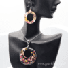 Captivating floral jewelry set with a radiant resin pendant and lightweight earrings, featuring vibrant dried flowers encased in premium resin.