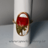 Handmade adjustable resin ring with a real red rose preserved inside and a gold-plated frame