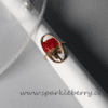 Handmade adjustable resin ring with a real red rose preserved inside and a gold-plated frame