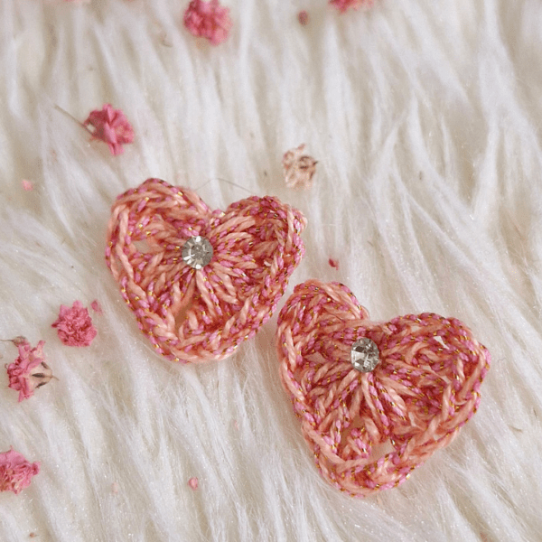 A pair of handcrafted Heart Stud Earrings made from delicate crochet