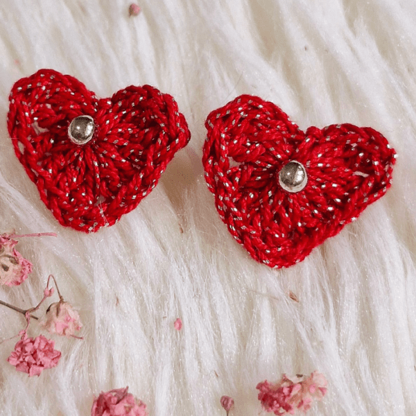 A pair of handcrafted Heart Stud Earrings made from delicate crochet