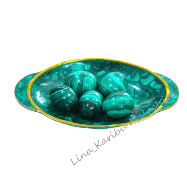 Polished handmade malachite eggs, 204g, deep green with natural swirls. Symbol of fertility and prosperity, crafted in the Democratic Republic of the Congo. Plate not included.