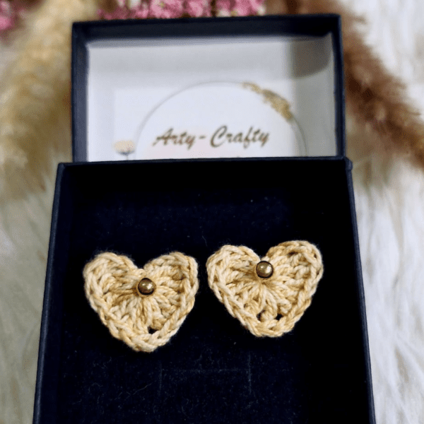 A pair of handcrafted Heart Stud Earrings made from delicate crochet