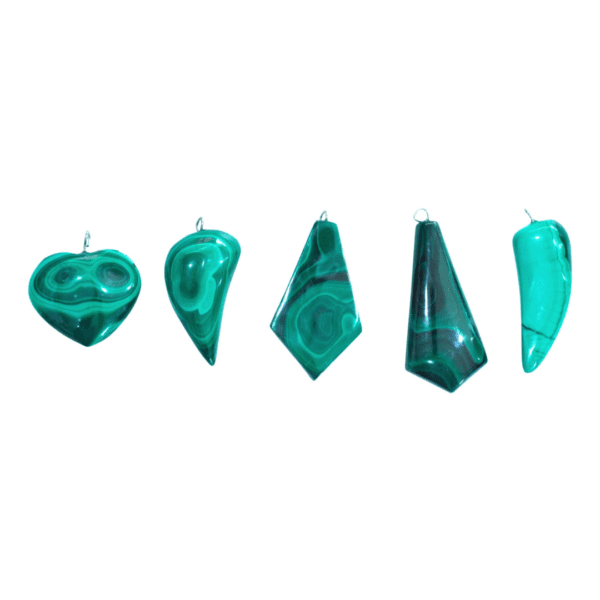 Assorted handmade malachite pendants with polished finish, crafted in the Democratic Republic of the Congo. Natural gemstone jewelry for transformation and protection.