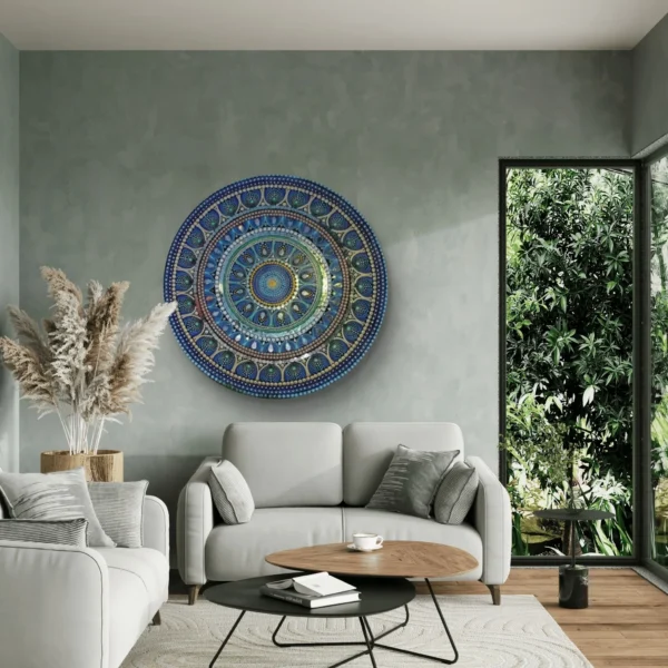 Large blue mandala painting hanging in a modern, nature-inspired living room.