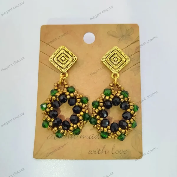 Handmade Emerald Noir Beaded Earrings featuring black and green faceted beads with gold accents and square stud tops.