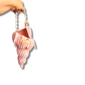 Light pink Nerida crochet shell bag with pearl handle and embellishments